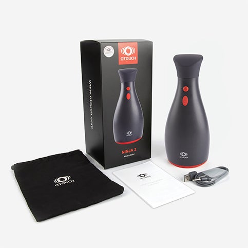Otouch Ninja 2 - Automaattinen masturbaattori, pakkaus, k&auml;ytt&ouml;ohjeet, laturi ja s&auml;ilytyspussi.